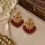 Traditional gold plated kundan chandbali earrings with red beads & green stones