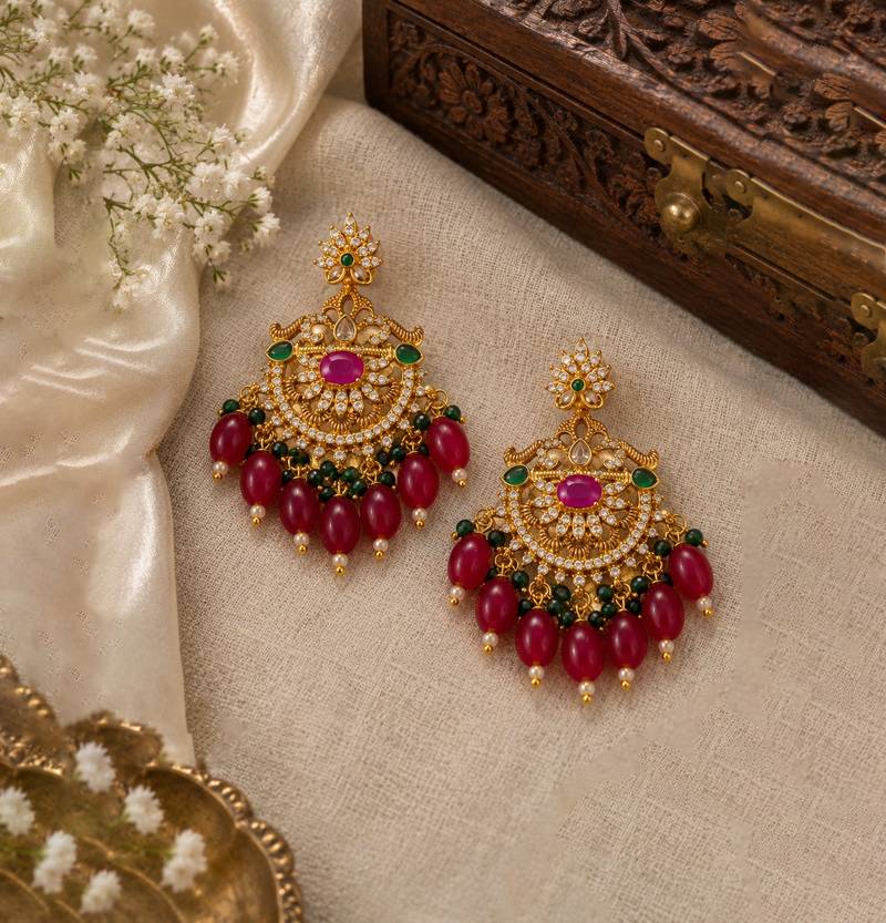 Traditional gold plated kundan chandbali earrings with red beads & green stones