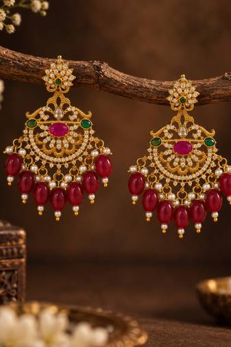 Traditional gold-plated kundan chandbali earrings with red beads & pearls