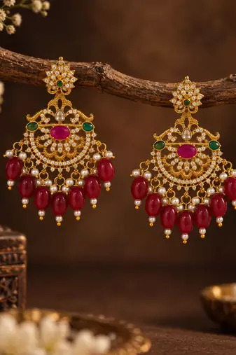 Traditional gold-plated kundan chandbali earrings with red beads & pearls