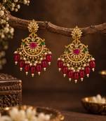 Traditional gold-plated kundan chandbali earrings with red beads & pearls