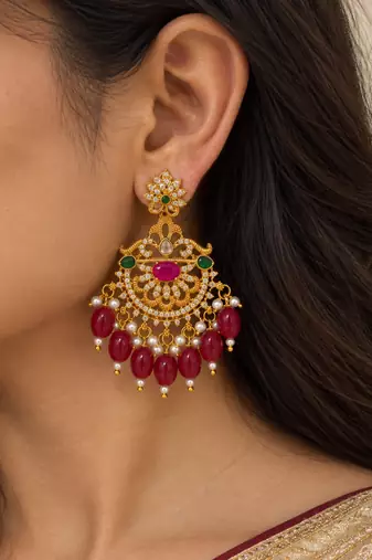 Traditional gold-plated kundan chandbali earrings with red beads & pearls