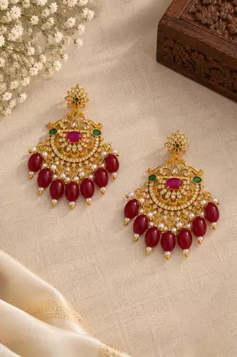 Traditional gold-plated kundan chandbali earrings with red beads & pearls