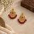 Traditional gold-plated kundan chandbali earrings with red beads & pearls
