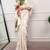 cream festive & party wear digital printed satin saree with pearl border