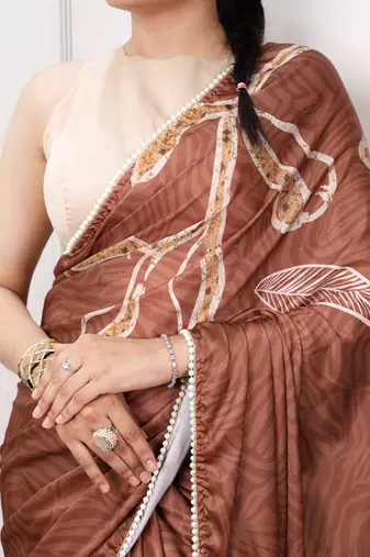 brown festive & party wear digital printed satin saree with pearl border