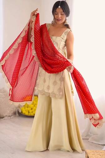 Cream embroidered kurta palazzo set with red bandhani dupatta