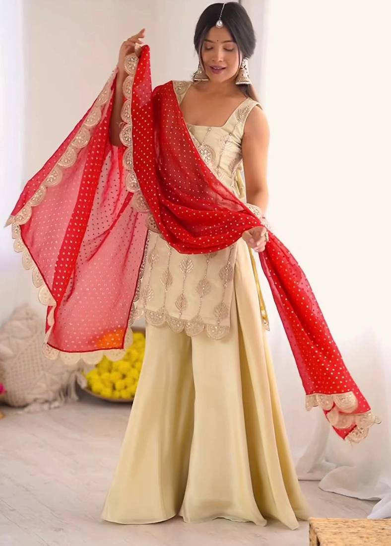 Cream embroidered kurta palazzo set with red bandhani dupatta