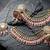 gold plated kundan & mirror work pastel pink jhumka earrings with ear chain