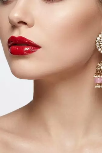 gold plated kundan & mirror work pastel pink jhumka earrings with ear chain