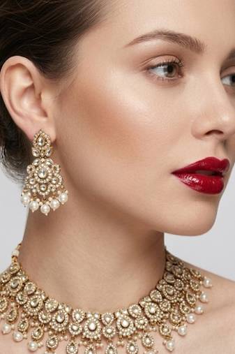 Gold plated kundan choker necklace set with pearl drops |