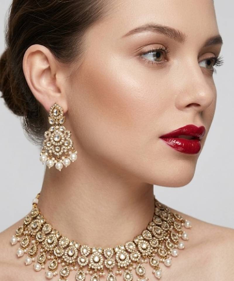 Gold plated kundan choker necklace set with pearl drops |