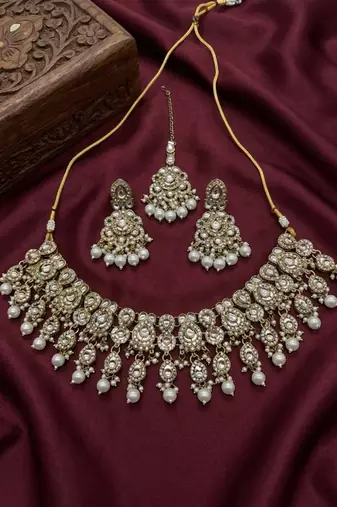 Gold plated kundan choker necklace set with pearl drops |