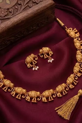 gold temple elephant necklace set with matching stud earrings