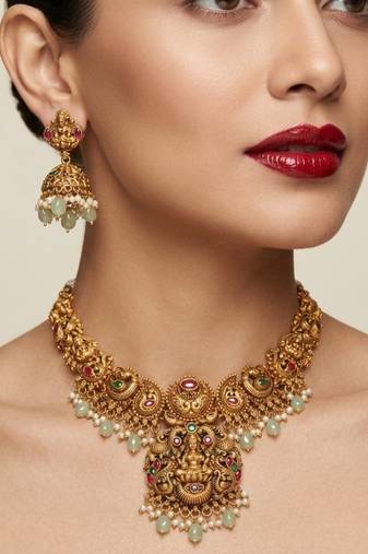 antique gold temple jewelry set: lakshmi necklace with jhumka earrings 