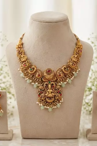 antique gold temple jewelry set: lakshmi necklace with jhumka earrings 