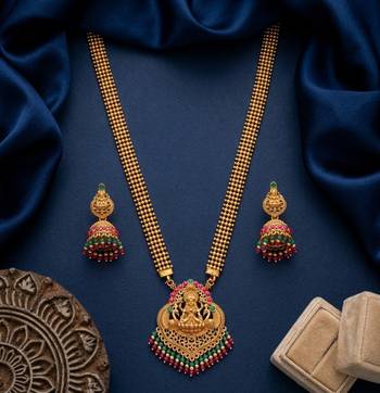 gold temple jewelry set with goddess lakshmi pendant, green & red beads & jhumkas  1