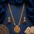 gold temple jewelry set with goddess lakshmi pendant, green & red beads & jhumkas 