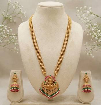 gold temple jewelry set with goddess lakshmi pendant, green & red beads & jhumkas  2