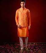 Orange embroidered raw silk kurta and nehru jacket