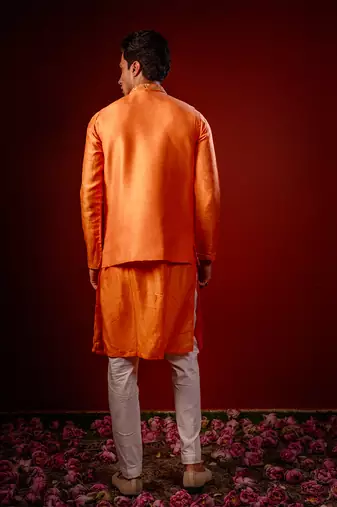 Orange embroidered raw silk kurta and nehru jacket