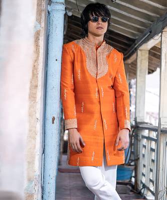 Saffron orange embroidered raw silk sherwani set 1