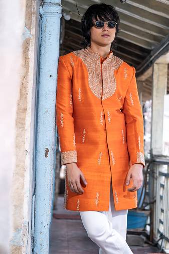 Saffron orange embroidered raw silk sherwani set