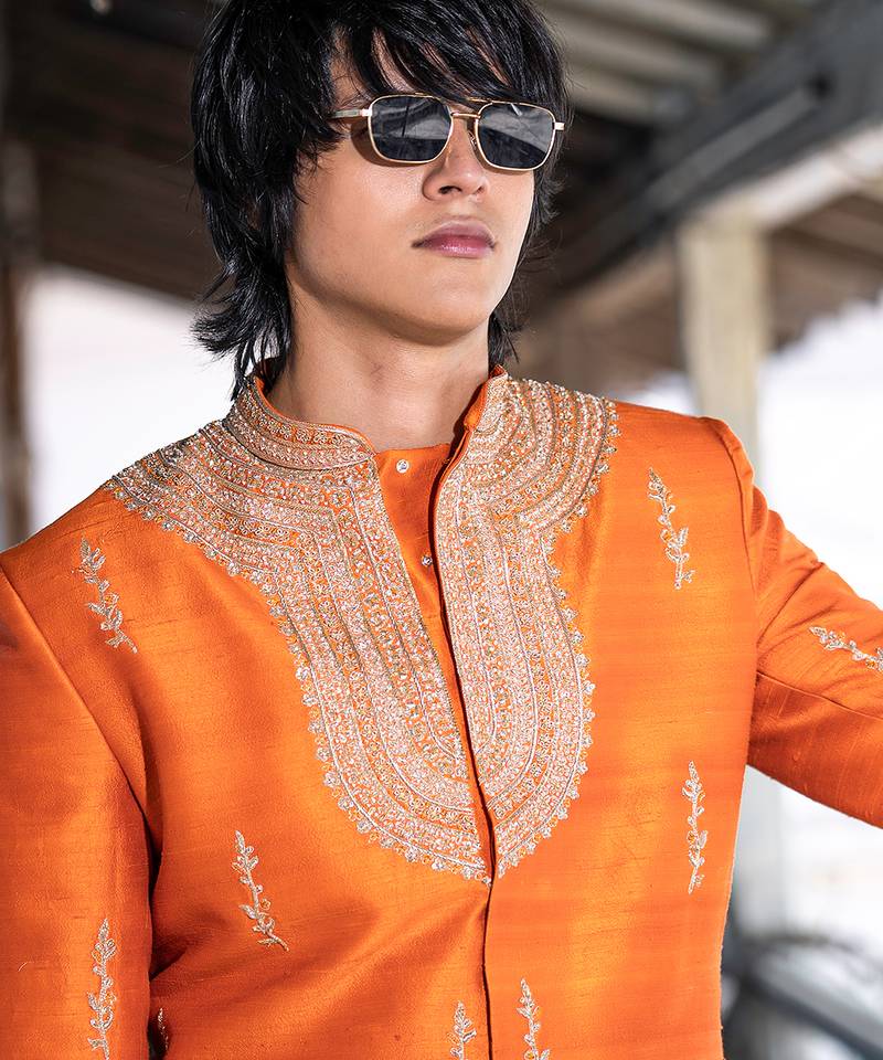 Saffron orange embroidered raw silk sherwani set