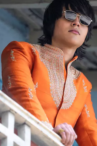 Saffron orange embroidered raw silk sherwani set