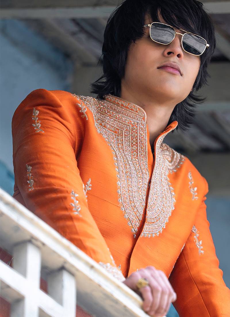 Saffron orange embroidered raw silk sherwani set