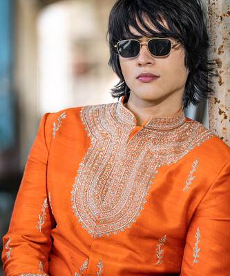 Saffron orange embroidered raw silk sherwani set 5