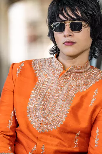 Saffron orange embroidered raw silk sherwani set