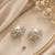 Silver tone circular cz stud earrings