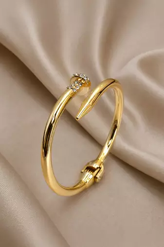 Anti tarnish gold tone nail cuff bracelet