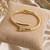 Anti tarnish gold tone nail cuff bracelet