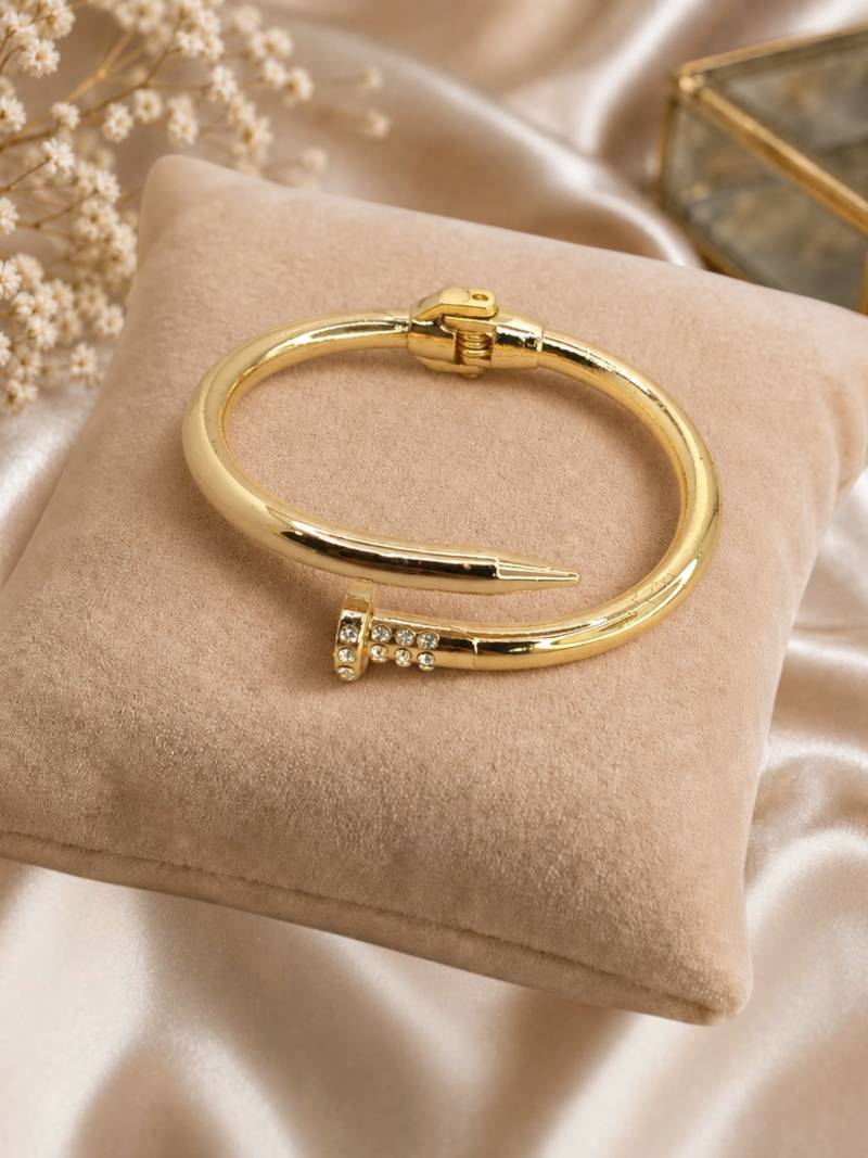 Anti tarnish gold tone nail cuff bracelet