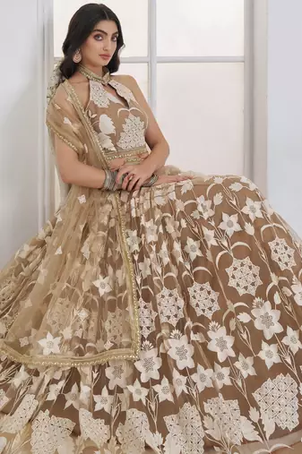 Dazzling Beige Embroidered Net Marriage Wear Lehenga With Blouse