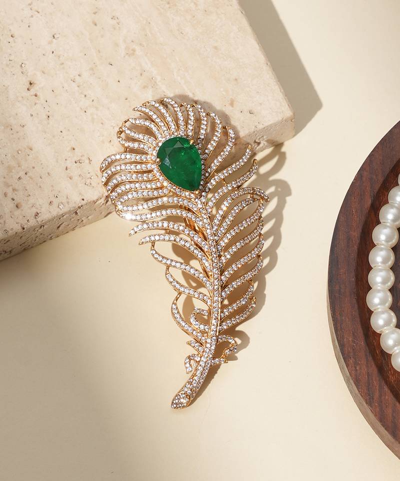 Gold plated green stone american diamond leaf brooch