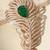 Gold plated green stone american diamond leaf brooch