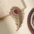Gold plated red stone american diamond leaf brooch