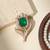 Gold plated green stone kundan rose motif brooch