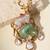 Gold plated mint green kundan deer motif brooch