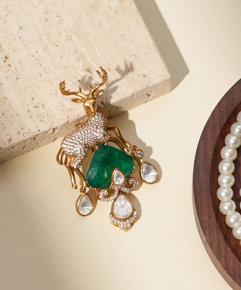 Gold plated green stone kundan dear motif brooch