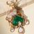 Gold plated green stone kundan dear motif brooch