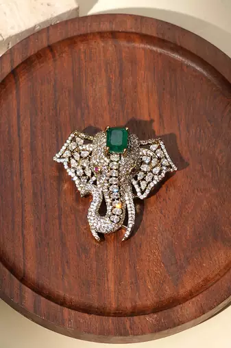 Gold plated green stone american diamond brooch