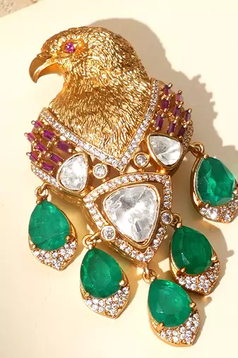 Gold plated green stones royal eagle motif brooch