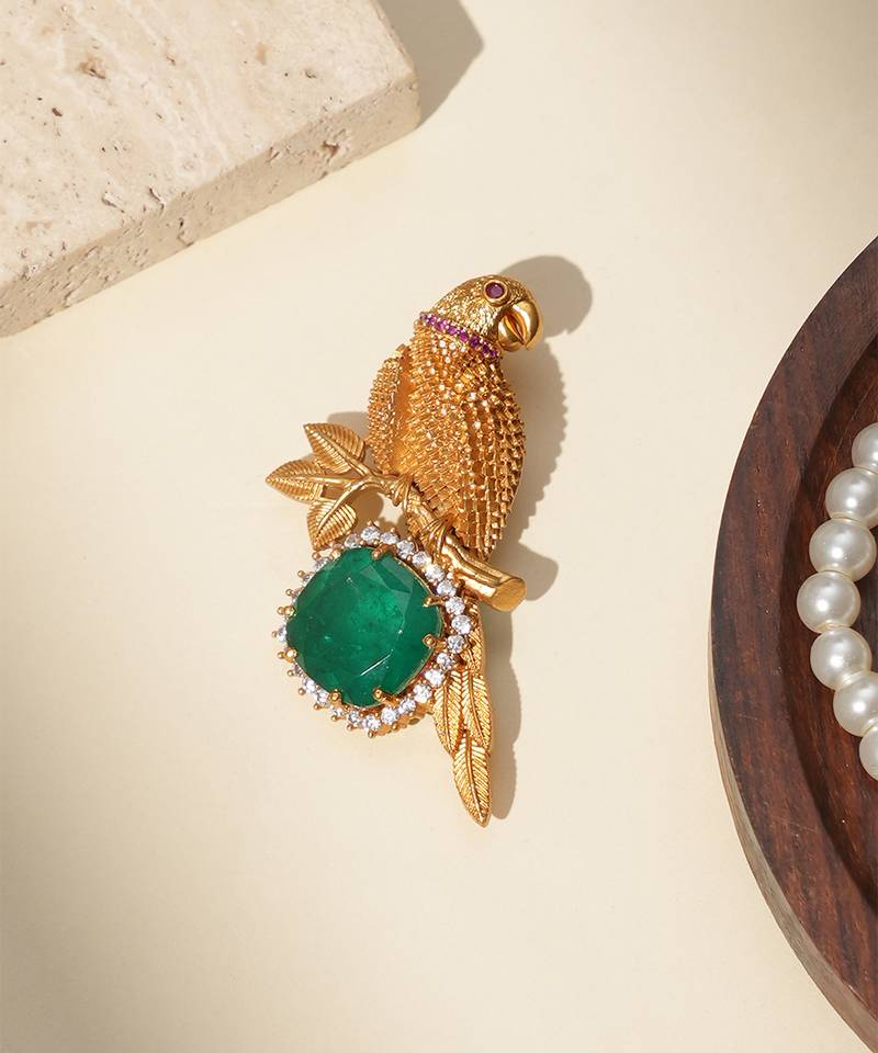 Gold plated green stone parrot motif heritage brooch