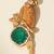 Gold plated green stone parrot motif heritage brooch