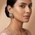 Gold plated green stones kundan stud earrings