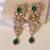 Gold plated green stones kundan long earrings